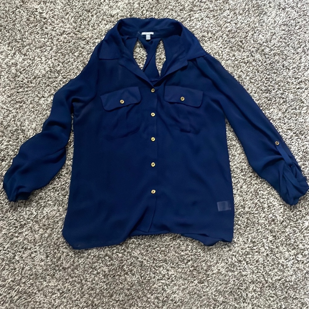 Sheer blue blouse. Has some skits on the back and buttons on bottom sleeves